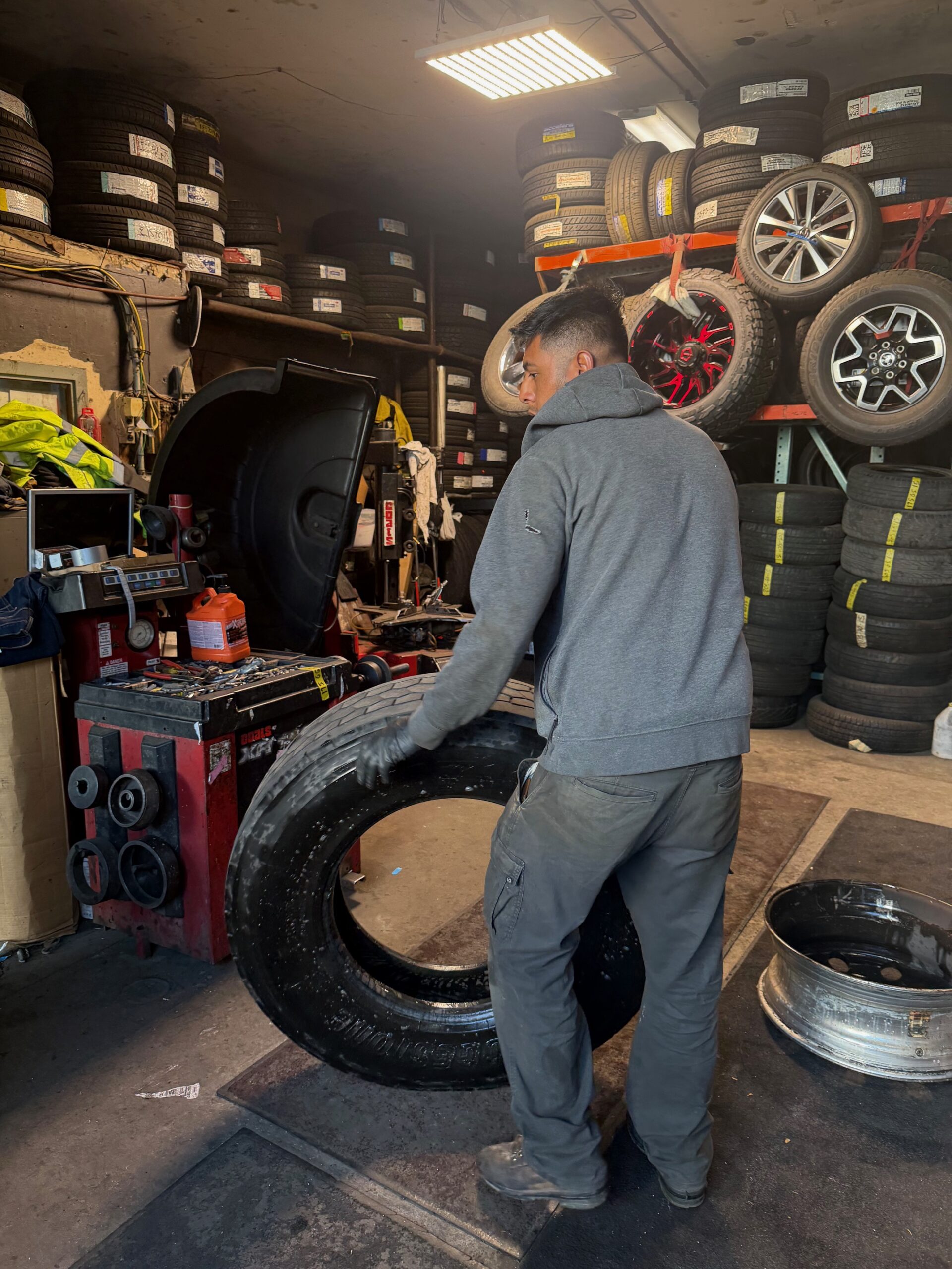 Lee's Tire Service technician working on heavy-duty truck tire in South San Francisco