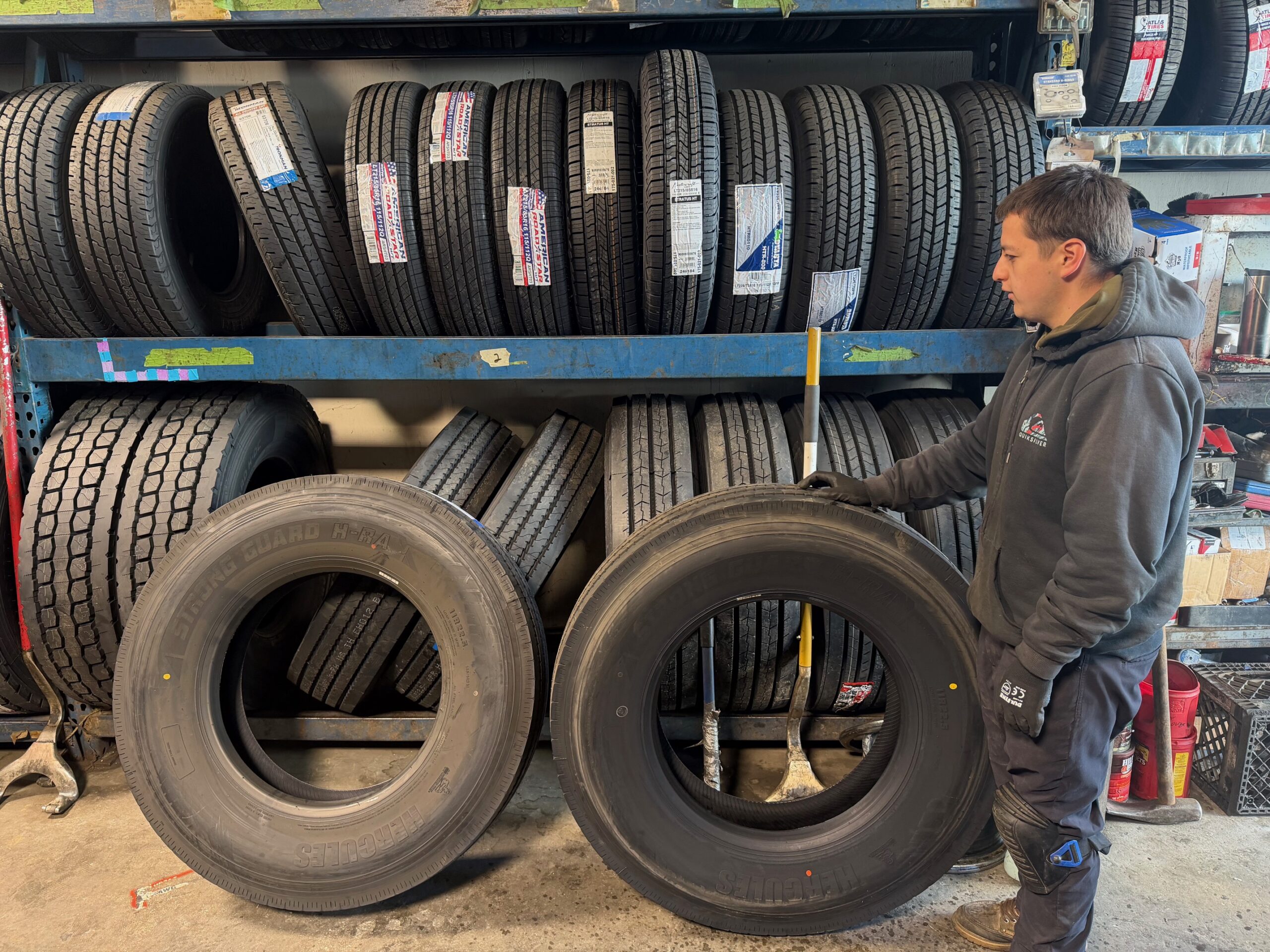 Technician performing tire service for commercial and passenger vehicles in South San Francisco